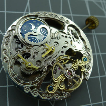  automatic mechanical watch with silver hands and hollow moon phase display at 12 o'clock.