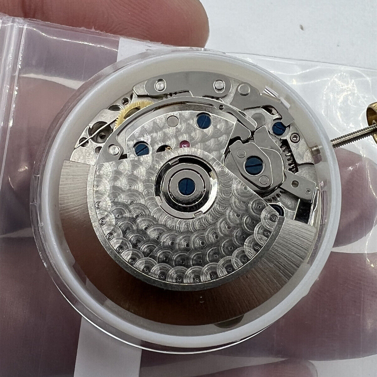 Black Dandong watch accessory with 7753 7750 automatic movement, small seconds at 9 o'clock, China made.