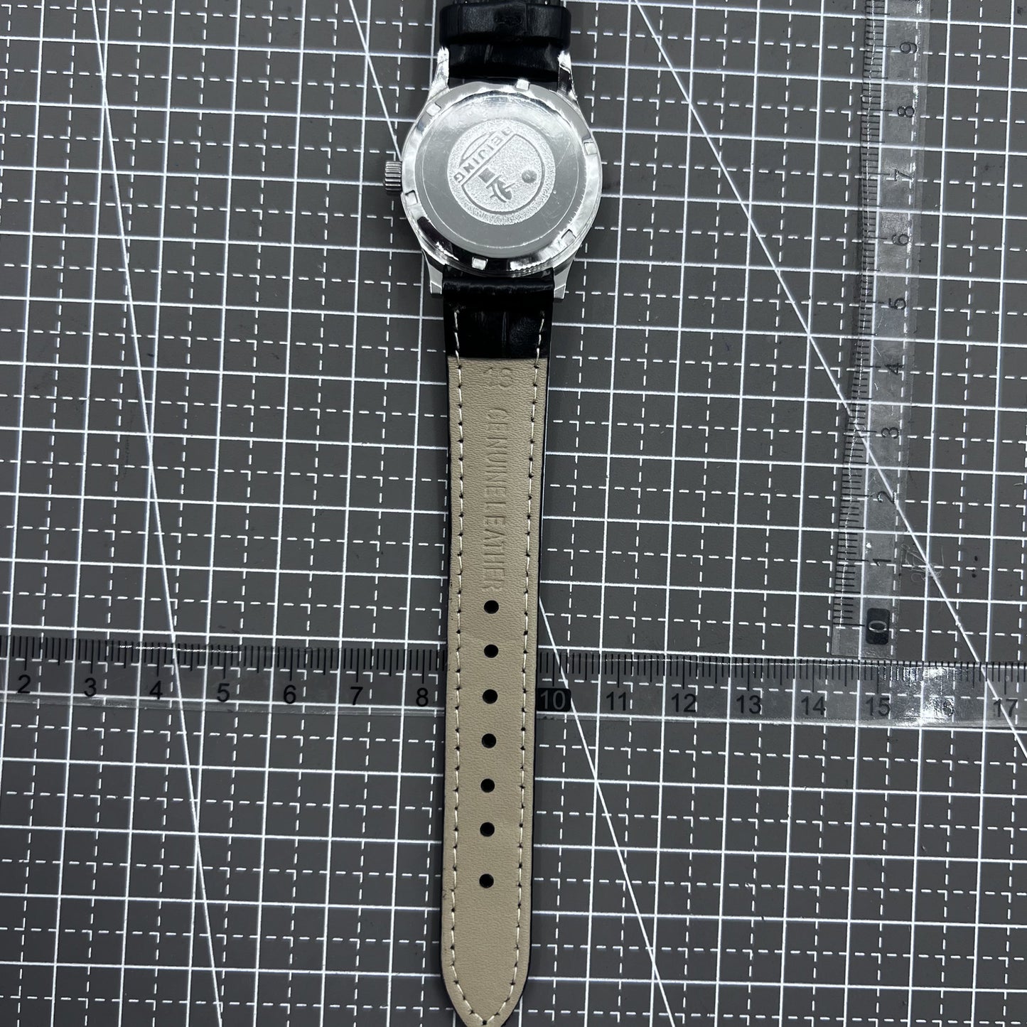 Beijing 31mm mechanical watch with silver case, black double rhomb strap, and classic three hands for timeless style.