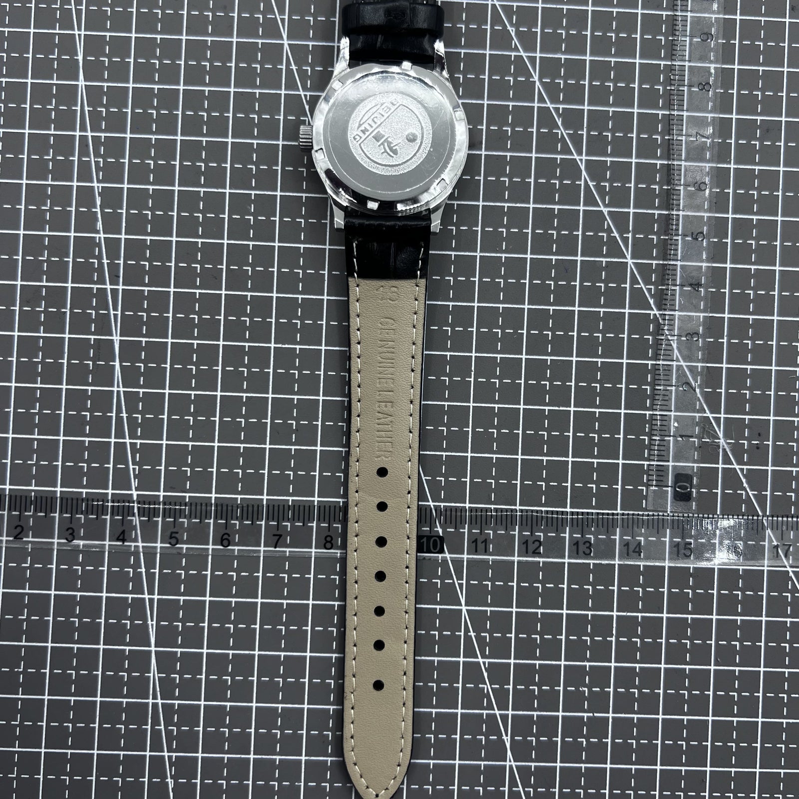 Beijing 31mm mechanical watch with silver case, black double rhomb strap, and classic three hands for timeless style.