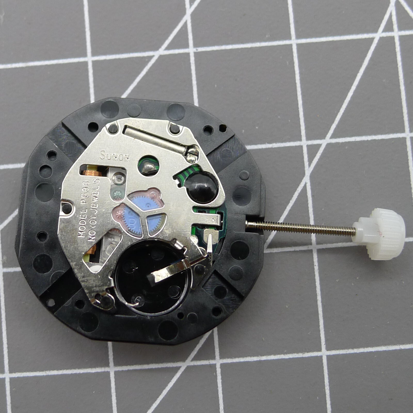 Sunon PE80 quartz watch movement featuring three hands and small seconds at 3, 6, and 9 o'clock positions for precision timekeeping.