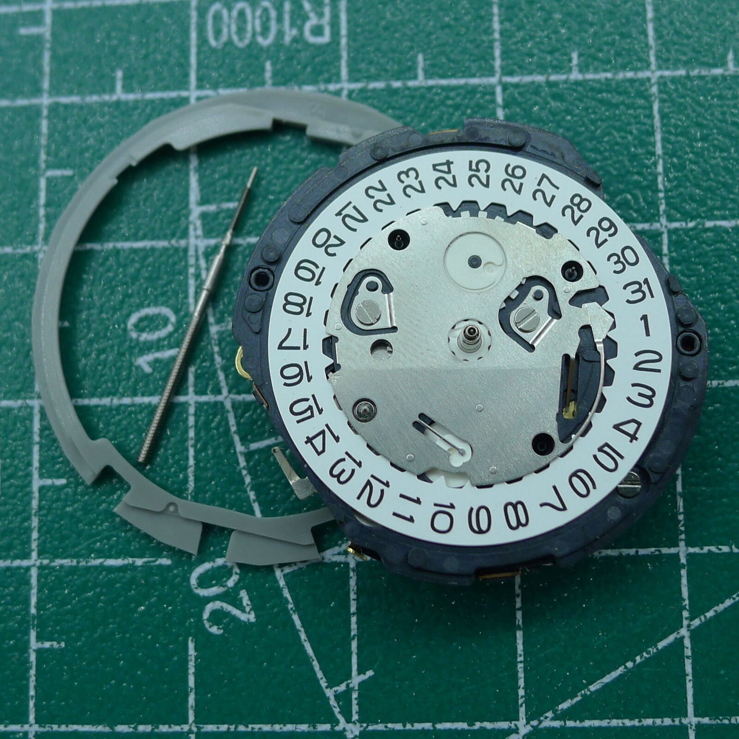 Hattori Epson TMI YM12 quartz watch movement for precise timekeeping, Japan made, ideal for watch repairs.