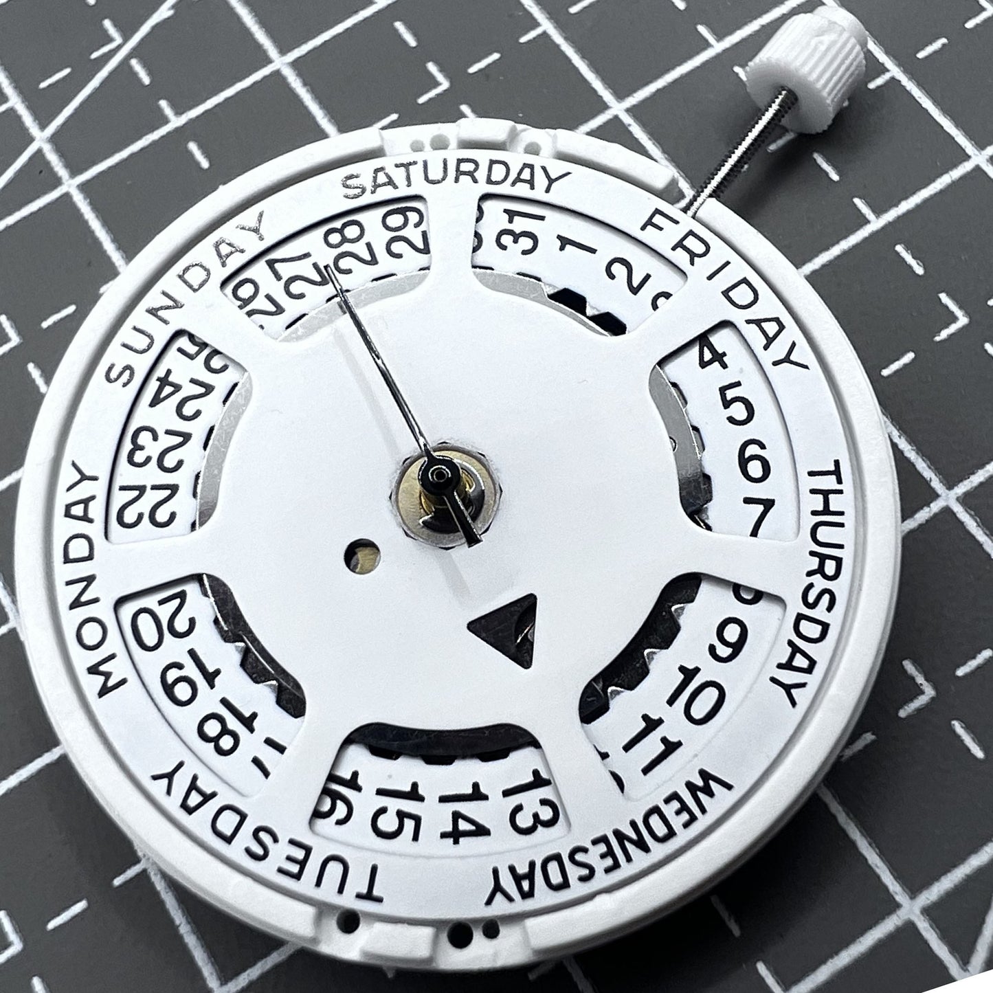 Swiss ISA 1198 quartz watch movement with day and date function for precise timekeeping.