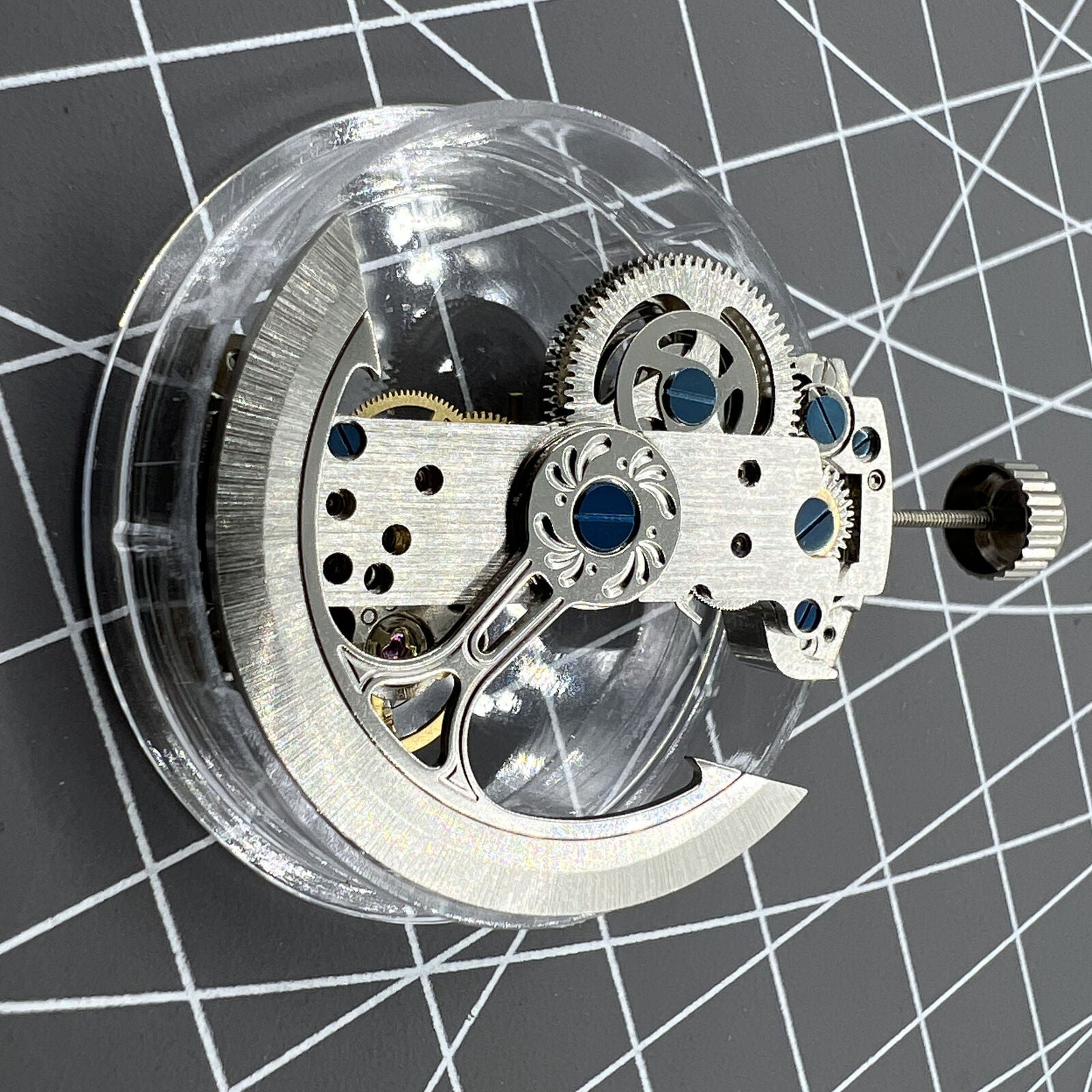 LG0807 silver rectangular balance wheel watch movement displaying intricate automatic mechanical design for precision timekeeping.