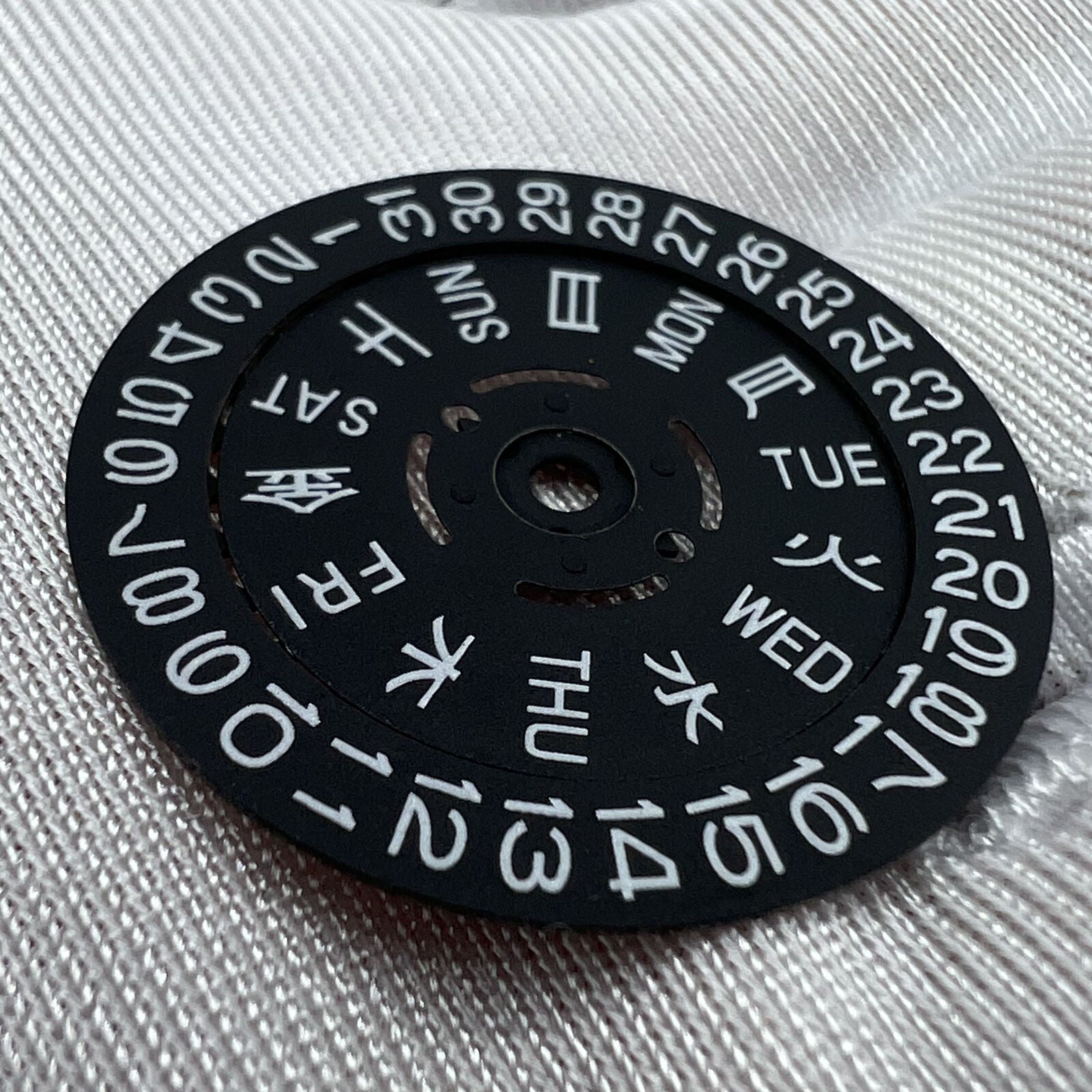 Black date disk wheel with blue and green lume accents, for NH36 watch movement, date at 3 o?clock.