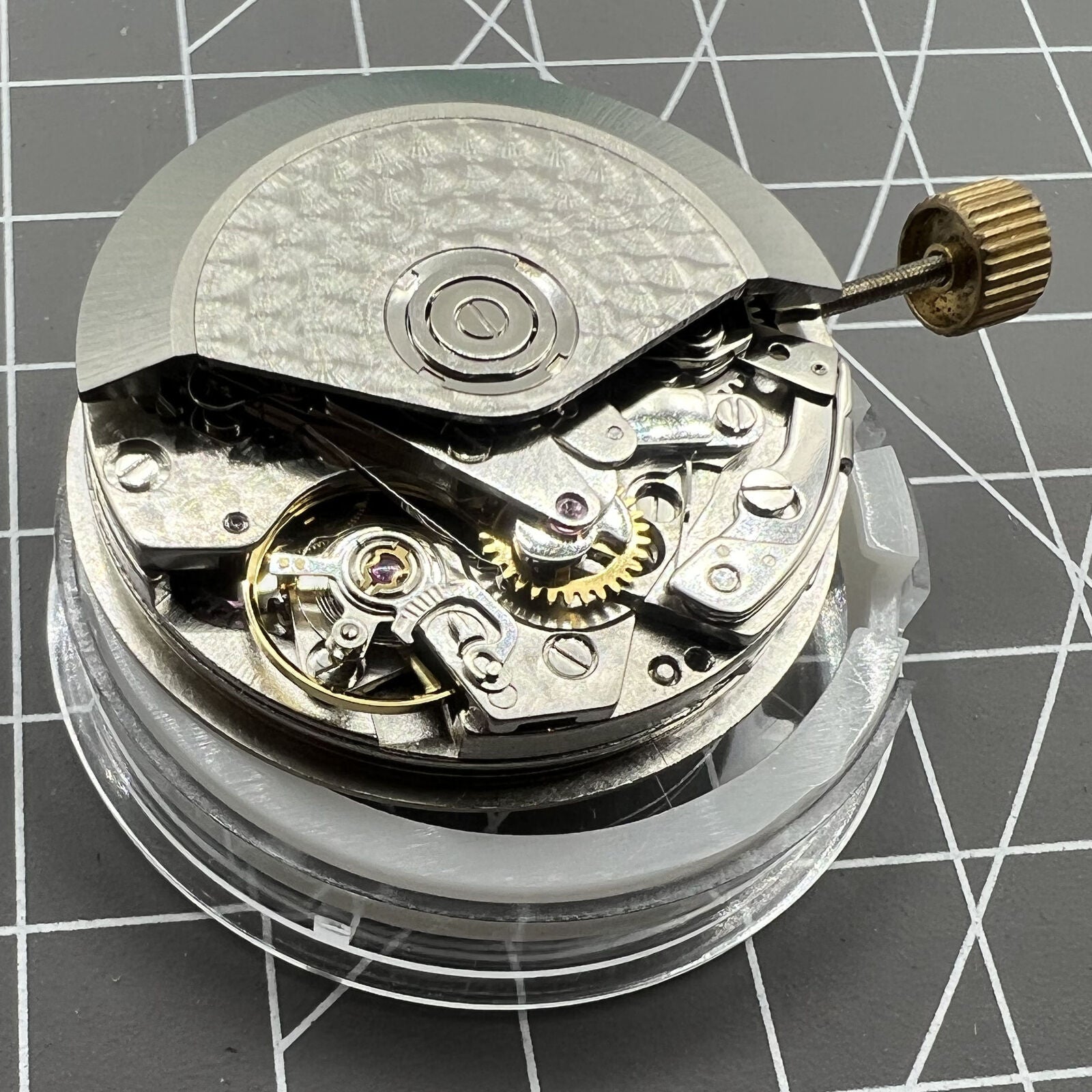 ETA Brand #7750 automatic chronograph watch movement with detailed subdials at 3, 6, and 9 o'clock positions.