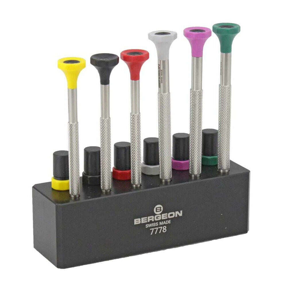 Swiss Bergeon 7778 screwdriver set with 6 precision blades and organizer stand for watch repair tasks.