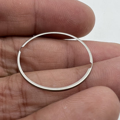 Steel watch dial mount spacer ring for ETA 2824 movement, ensuring precise dial alignment.