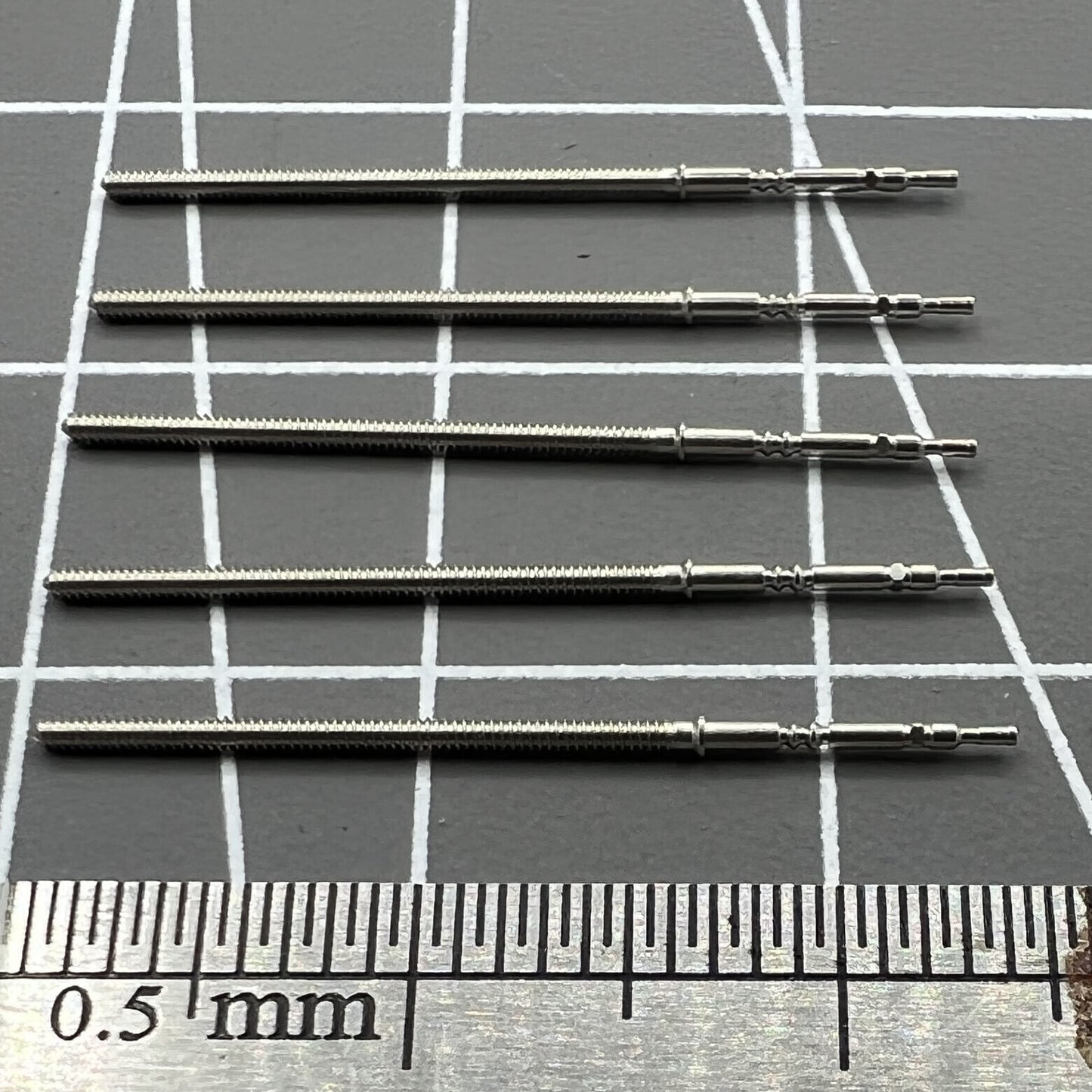 Set of 5 replacement winding stems for PE90 movement watches, durable and precise watch accessory.