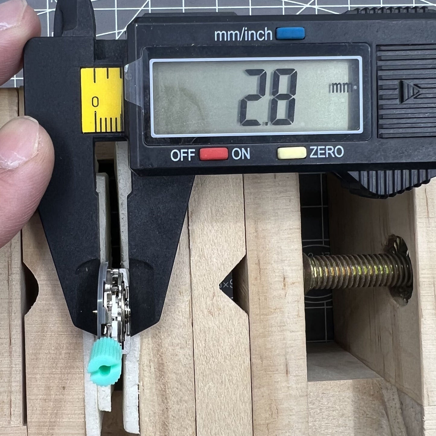 NH06A Japan-made watch movement displaying double calendar date window at 3 o'clock with precise timekeeping.