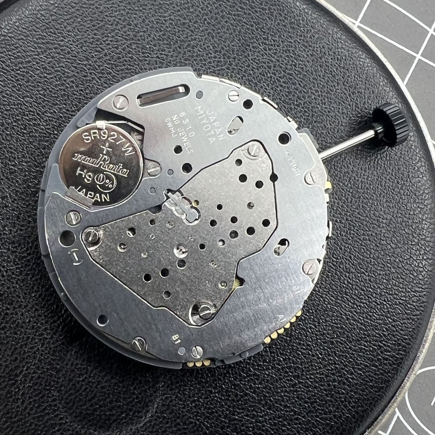 Miyota 6S10 quartz watch movement featuring small seconds at 6, 9, and 12 o'clock, date window at 3.