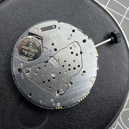 Miyota 6S10 quartz watch movement featuring small seconds at 6, 9, and 12 o'clock, date window at 3.