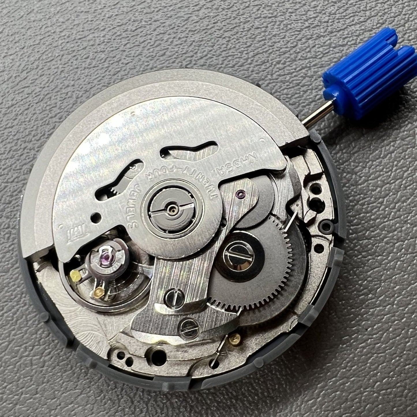 Japan NH35 automatic chronograph watch dial in black with date window and crown at 3 o?clock.