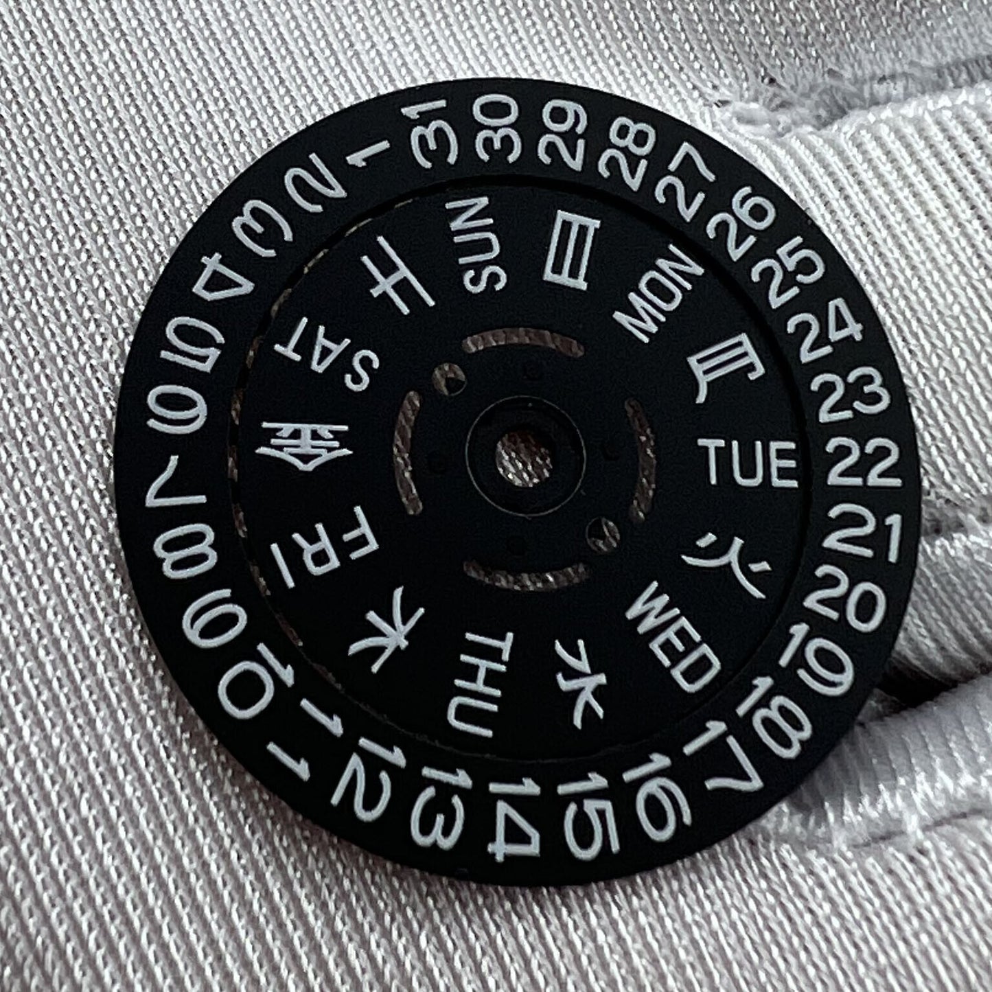 Black date disk wheel with blue and green lume accents for NH36 movement, date at 3 o?clock,