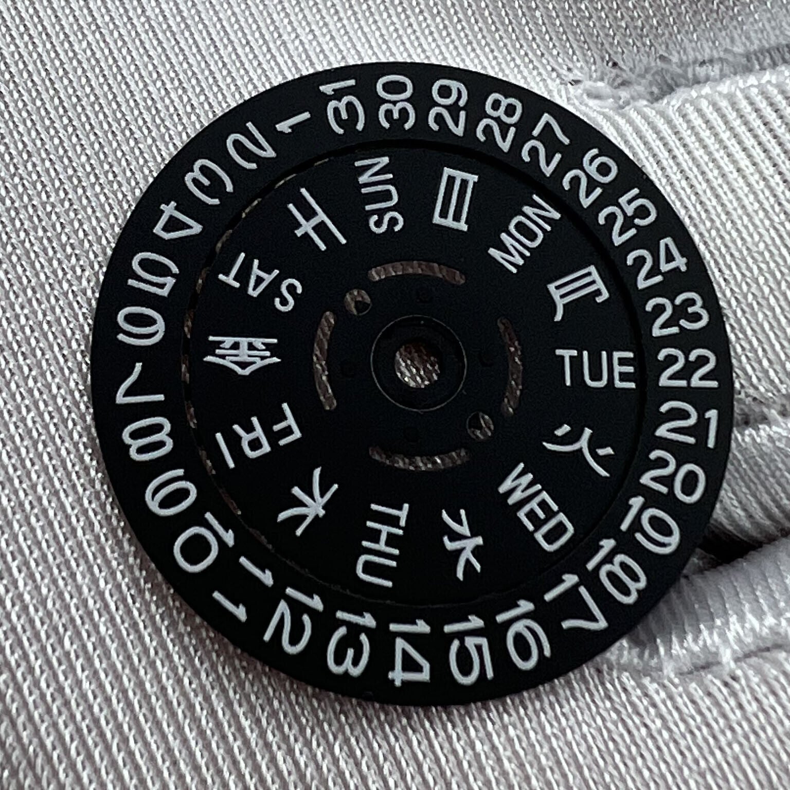 Black date disk wheel with blue and green lume accents for NH36 movement, date at 3 o?clock,