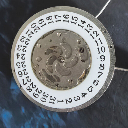 Silver mechanical watch part for big date single calendar, precision movement, ideal for China-made timepieces.