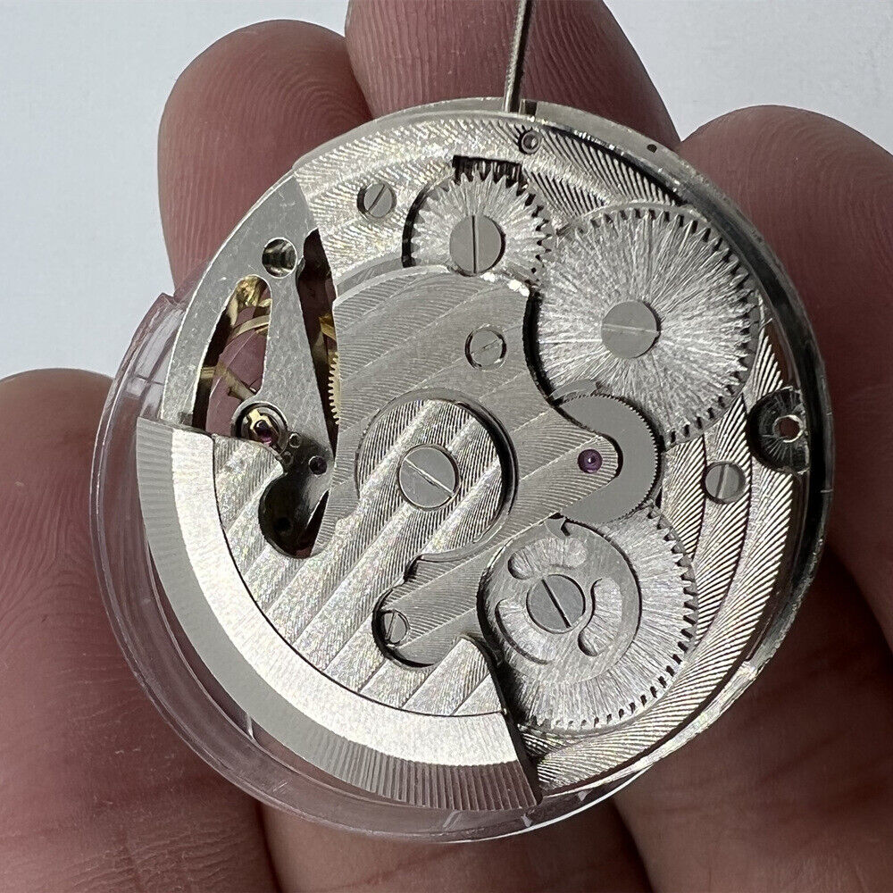 Silver automatic mechanical watch with moon phase display and three-hand movement.