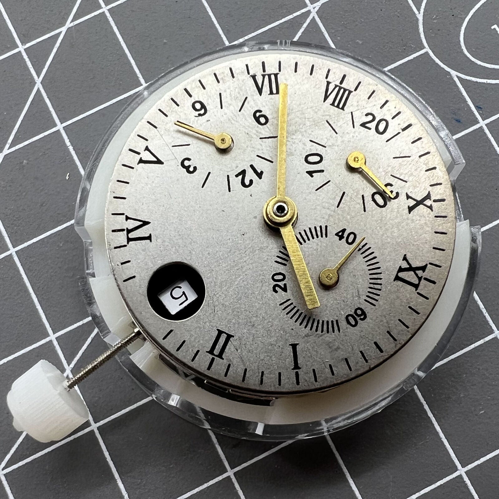 1. 7750 Automatic mechanical watch with small seconds at 12, precision timepiece.