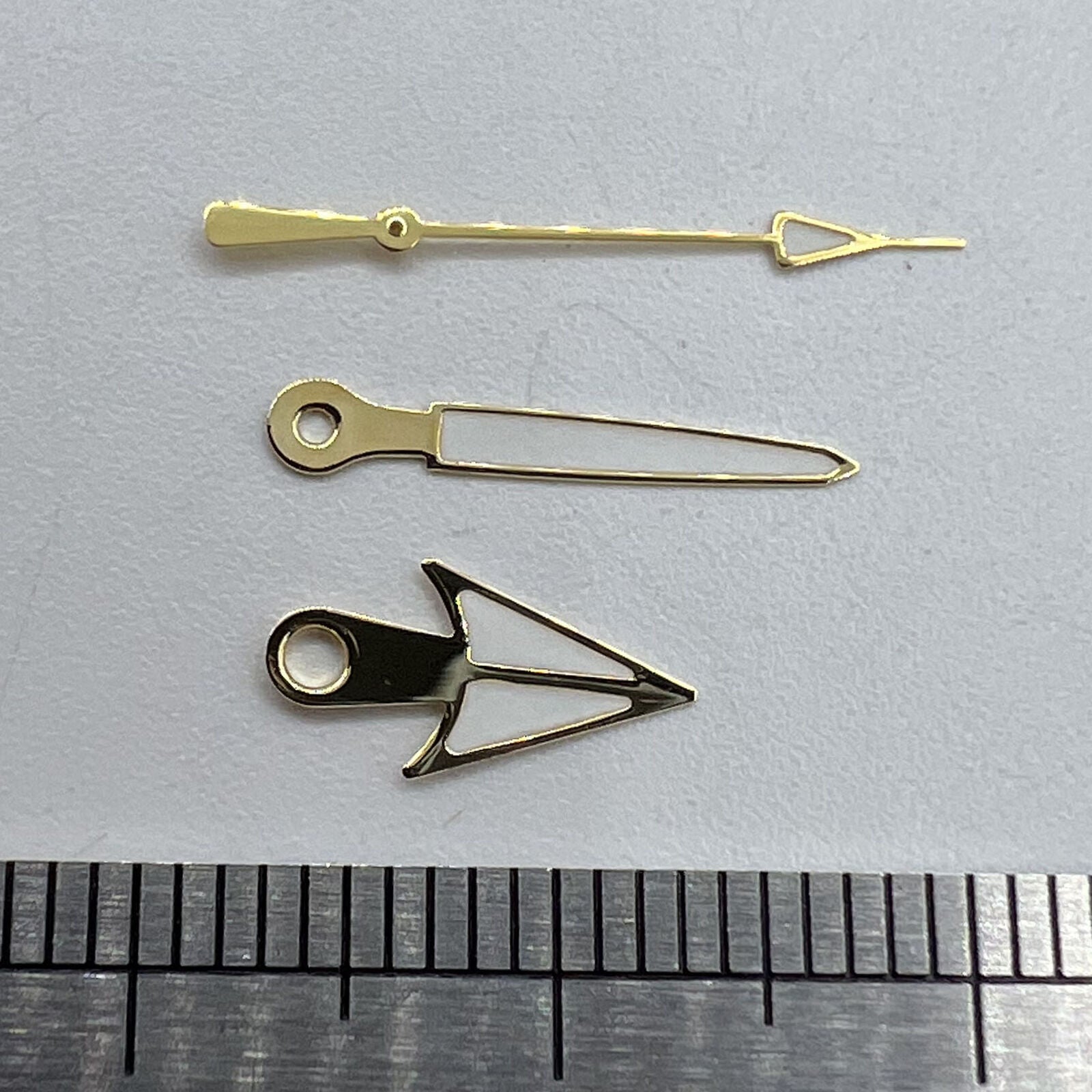 Arrow shape golden trim lume watch hands for Miyota NH35 movement, enhancing style and visibility.  