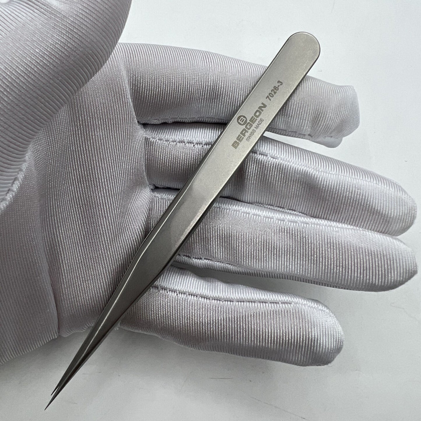 Swiss Bergeon antimagnetic fine hairspring tweezers model 7026-3 for precise watch repair.