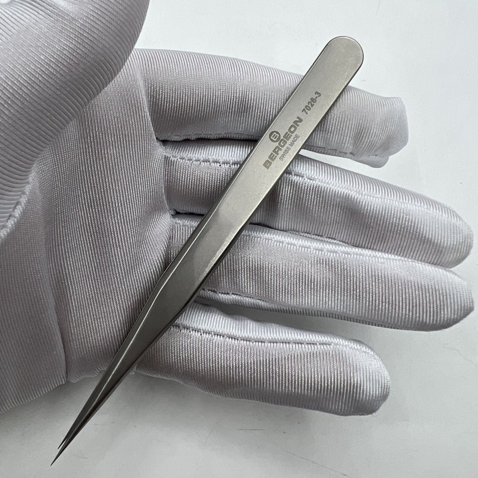 Swiss Bergeon antimagnetic fine hairspring tweezers model 7026-3 for precise watch repair.