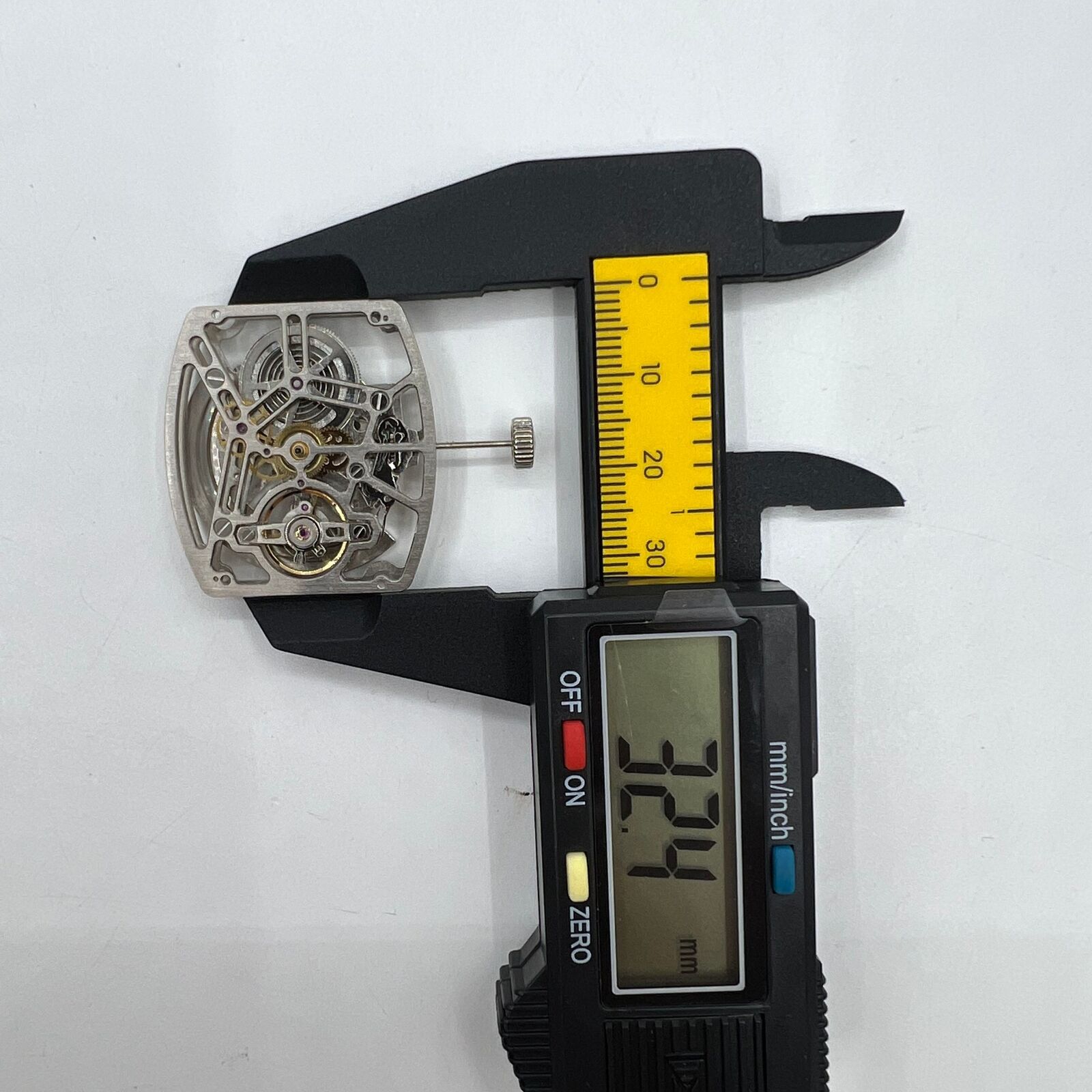 Asian HZ1C01A silver barrel-shaped watch accessory with automatic mechanical movement detail.