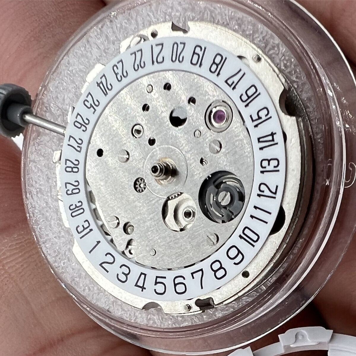 Miyota/Citizen 8215 silver plated automatic watch movement with date at 6, precision Japan-made mechanism.