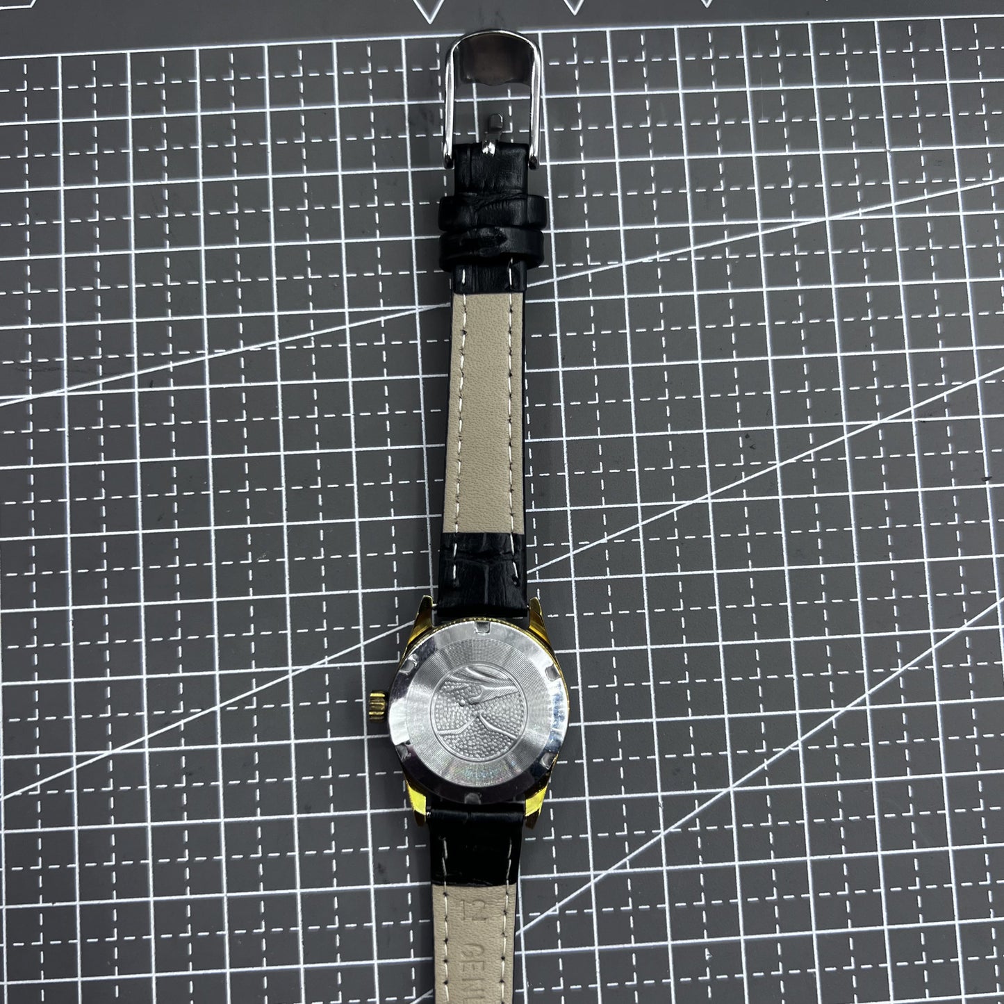 Black round case ladies watch with gold markers, Tianjin Seagull manual movement, elegant style.