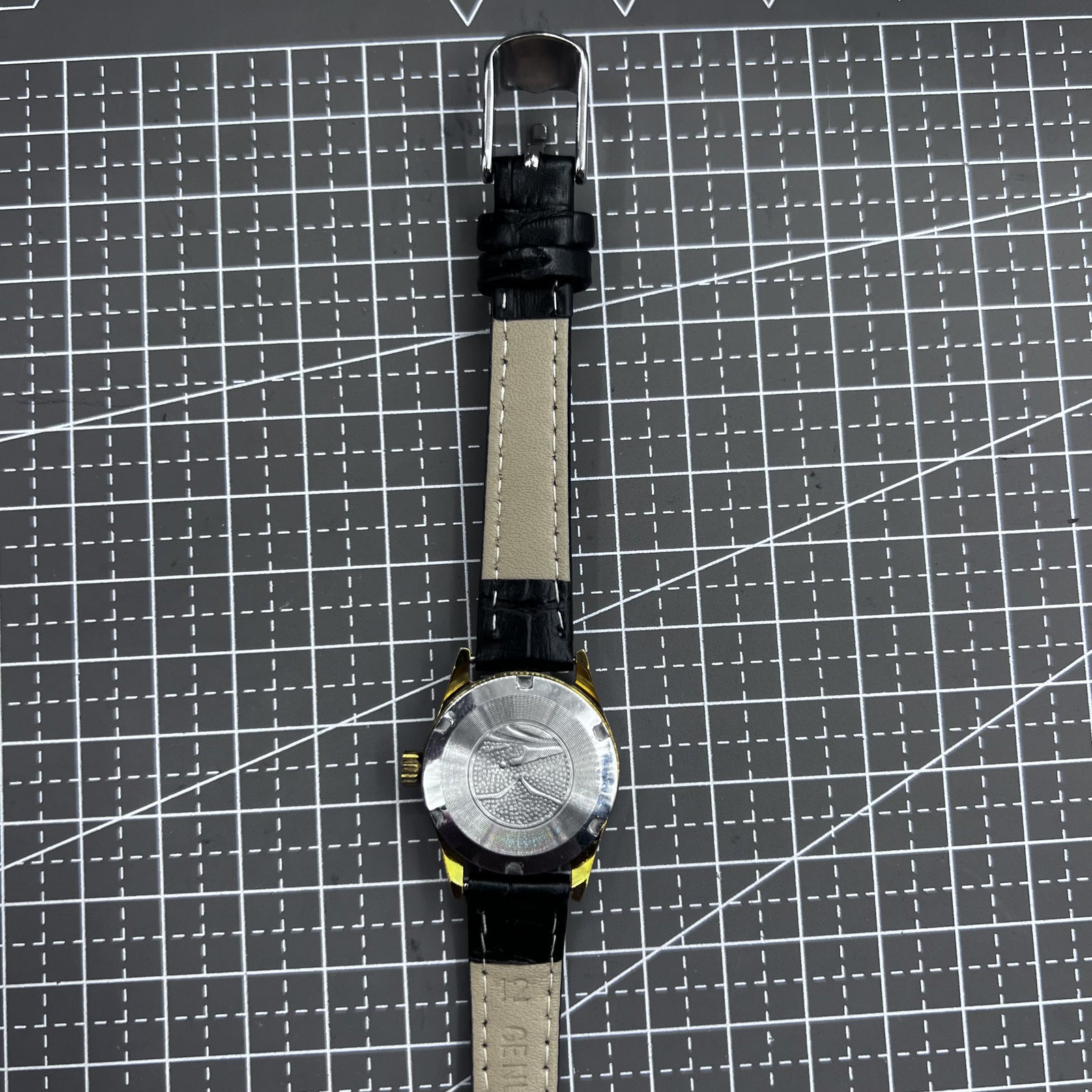 Black round case ladies watch with gold markers, Tianjin Seagull manual movement, elegant style.