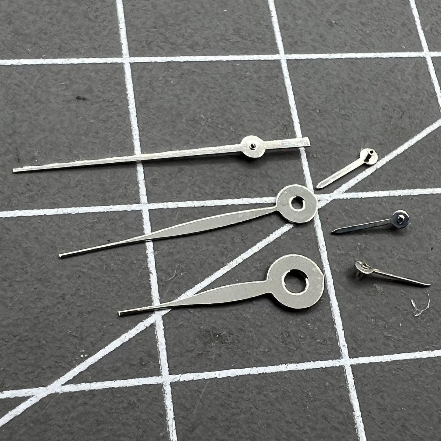 Silver 14mm arrow-style watch hands, no lume, fits Miyota 0S11 for precise timing adjustments.