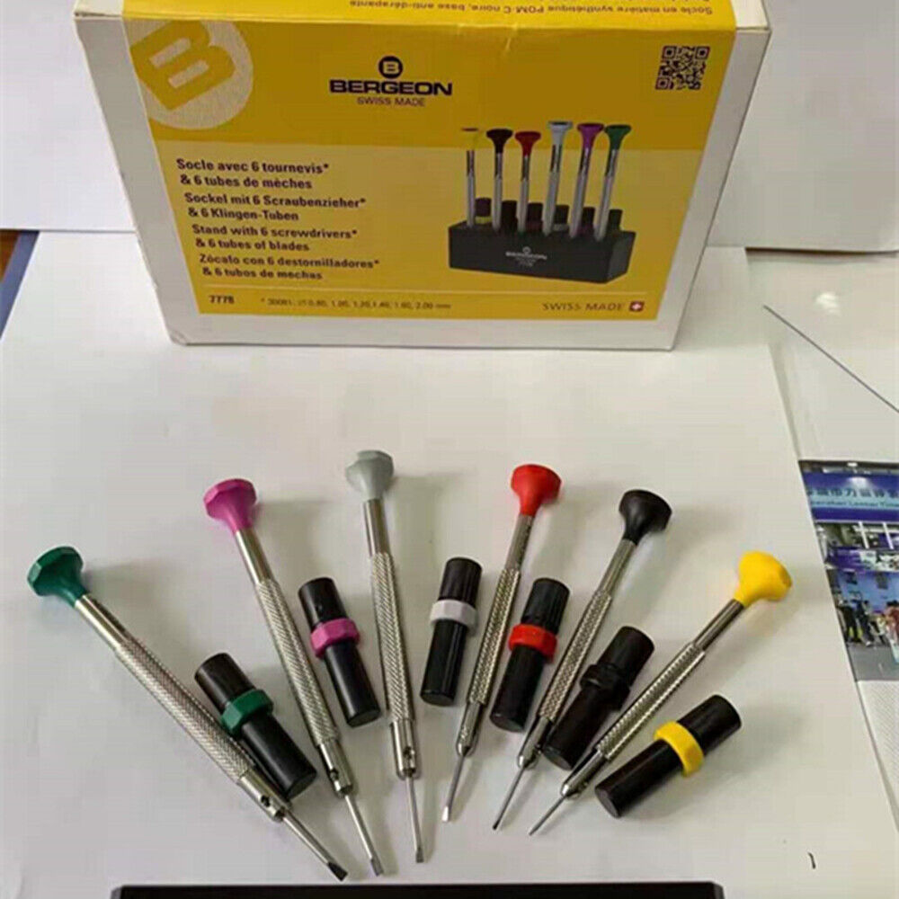 Swiss Bergeon 7778 watch screwdriver set with 6 precision blades, spare tips, and organizer stand for watch repair.