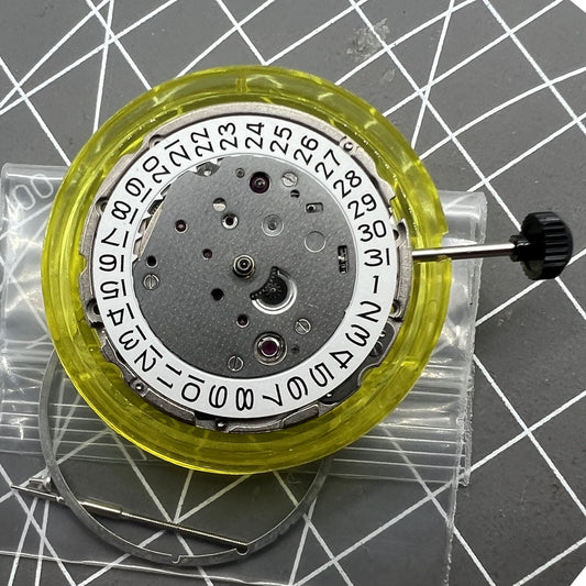 Miyota/Citizen 9019 automatic mechanical watch movement showing date window at 3 and 6, Japan made.