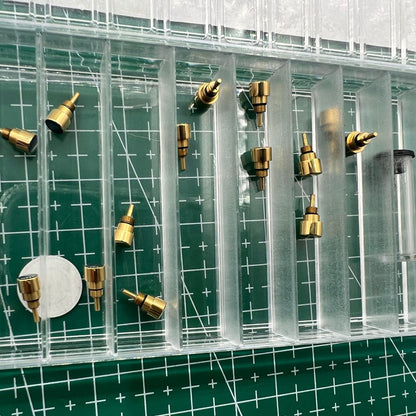 Golden stainless steel watch with classical pusher drive, durable and elegant for refined timekeeping.