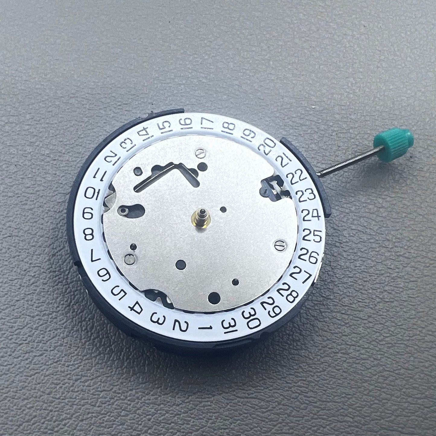 Swiss ISA 8371C quartz movement by ISA, multifunctional watch mechanism for precise timekeeping.