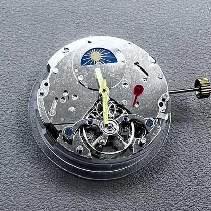 Silver Asian Dandong automatic watch with mechanical movement, date and week indicators, moon phase display.