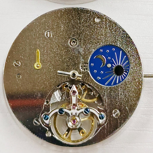 Silver hollow mechanical watch repair part with large flywheel, precise movement for China-made timepieces.