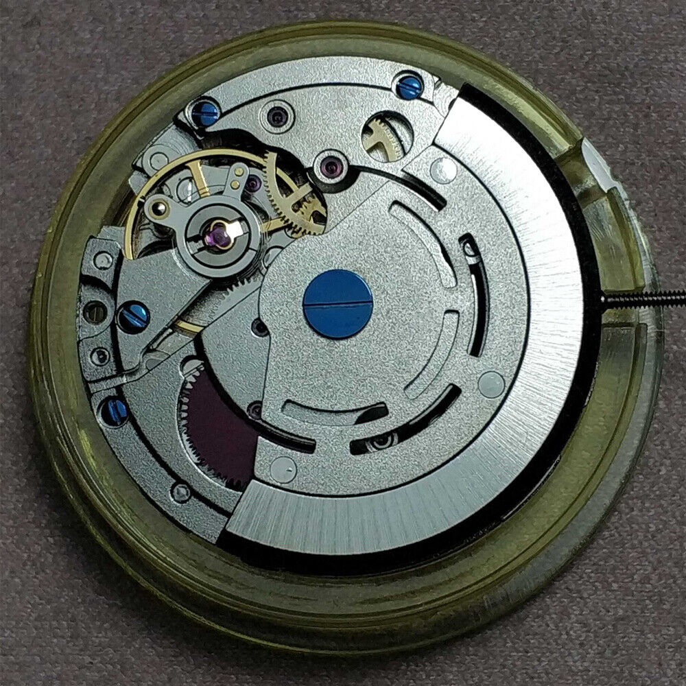 Asian Mingzhu GMT2813 dual time zone mechanical watch movement for precise timekeeping.