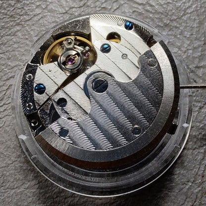 Seagull ST16 automatic watch movement with small seconds at 3, 6, and 9 o'clock positions, China made.
