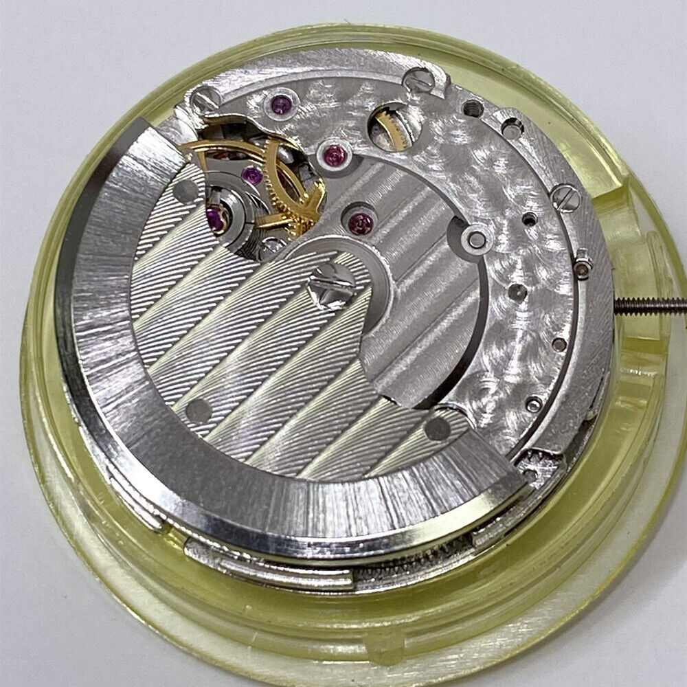 Mingzhu 2813 automatic watch movement showcasing moon phase at 12 o'clock and small second at 6 o'clock dial.