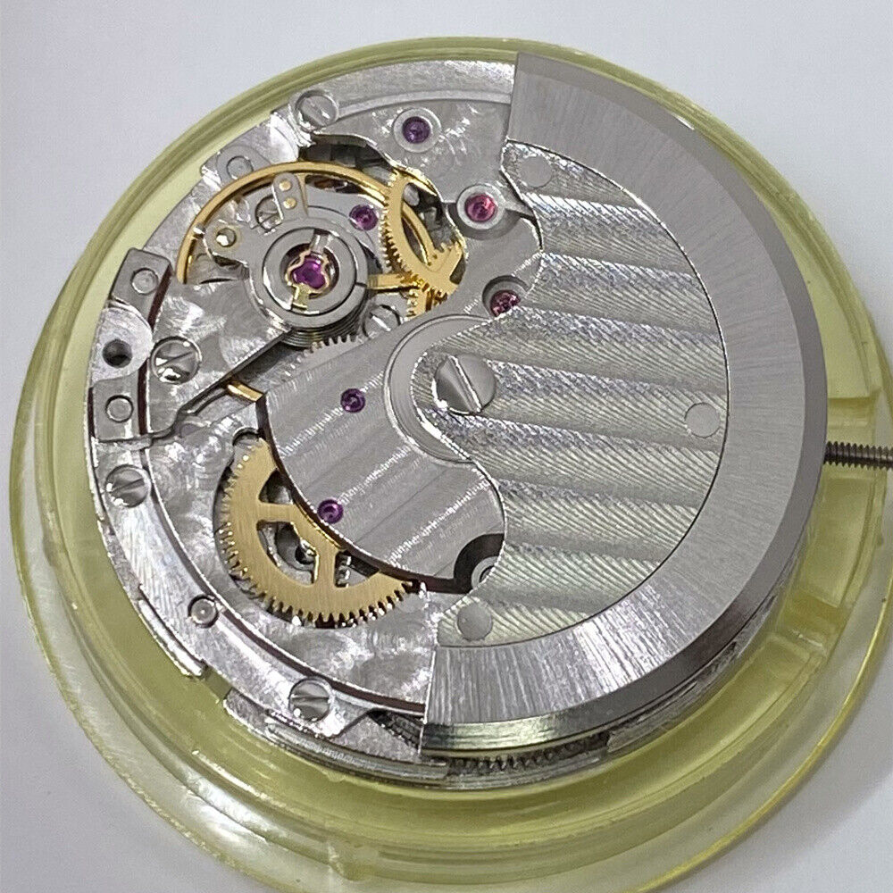 Mingzhu 2813 automatic watch movement displaying moon phase at 12 o'clock and small seconds subdial at 6 o'clock.