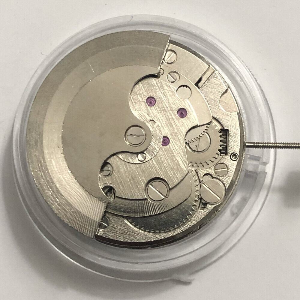 China Made 7120 watch showcasing automatic mechanical movement with balance wheel at 9 o?clock and moon phase at 6 o?clock.