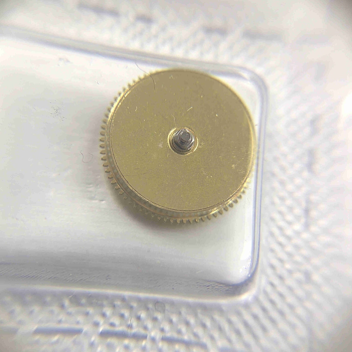 Golden barrel mainspring housing for Miyota 8200 8215 watch movement, durable replacement part.