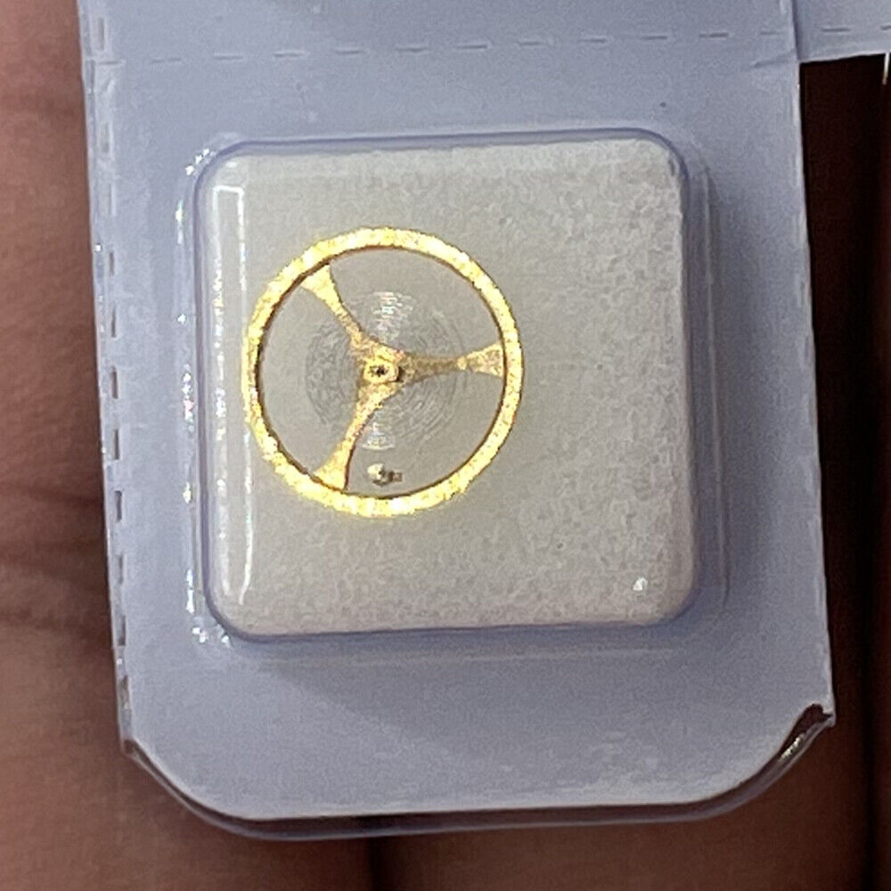 Golden balance wheel with hairspring for Orient 46941 46943 movement, precision watch accessory.