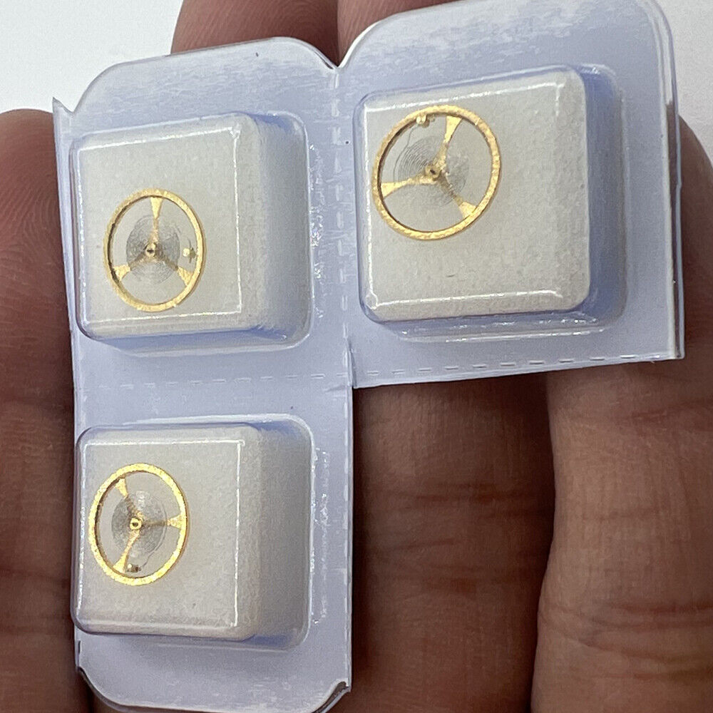 Golden balance wheel with hairspring for Orient 46941 46943 movement, precision watch component enhancing accuracy.