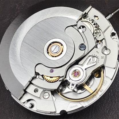 Close-up of Swiss Silver Day Date watch by Geneva V8 with ETA2836-2 mechanical movement on wrist.