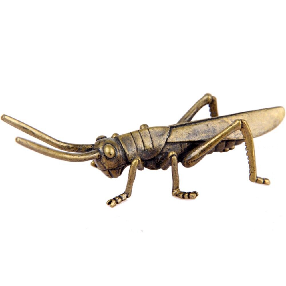 Vintage hand-carved solid copper grasshopper figurine, ideal for rustic home d�cor accents.