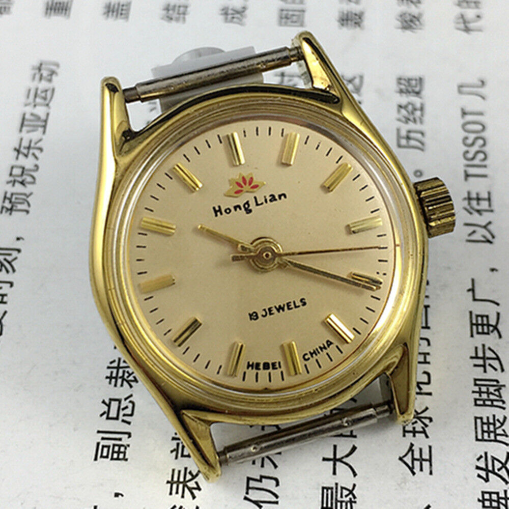 Elegant 26mm HONGLIAN manual mechanical lady watch with golden nail markers and round golden case, 3-hand display.