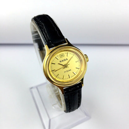 24mm HAIDA golden mechanical lady watch with 17 jewels and oval nail-style case design.