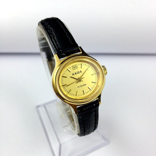24mm HAIDA golden mechanical lady watch with 17 jewels and oval nail-style case design.