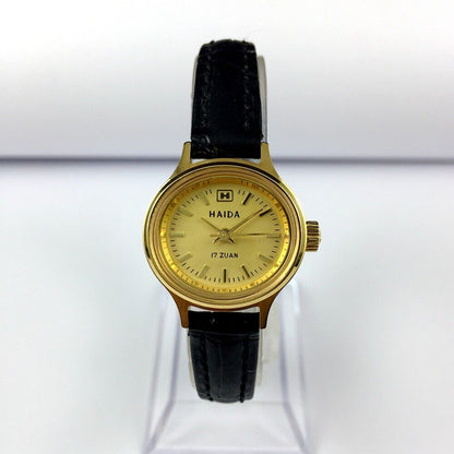 HAIDA 24mm golden lady watch with 17 jewels, mechanical movement, and oval nail-style case design.
